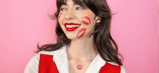 Kiss Necklace worn by a model with kiss marks on her face