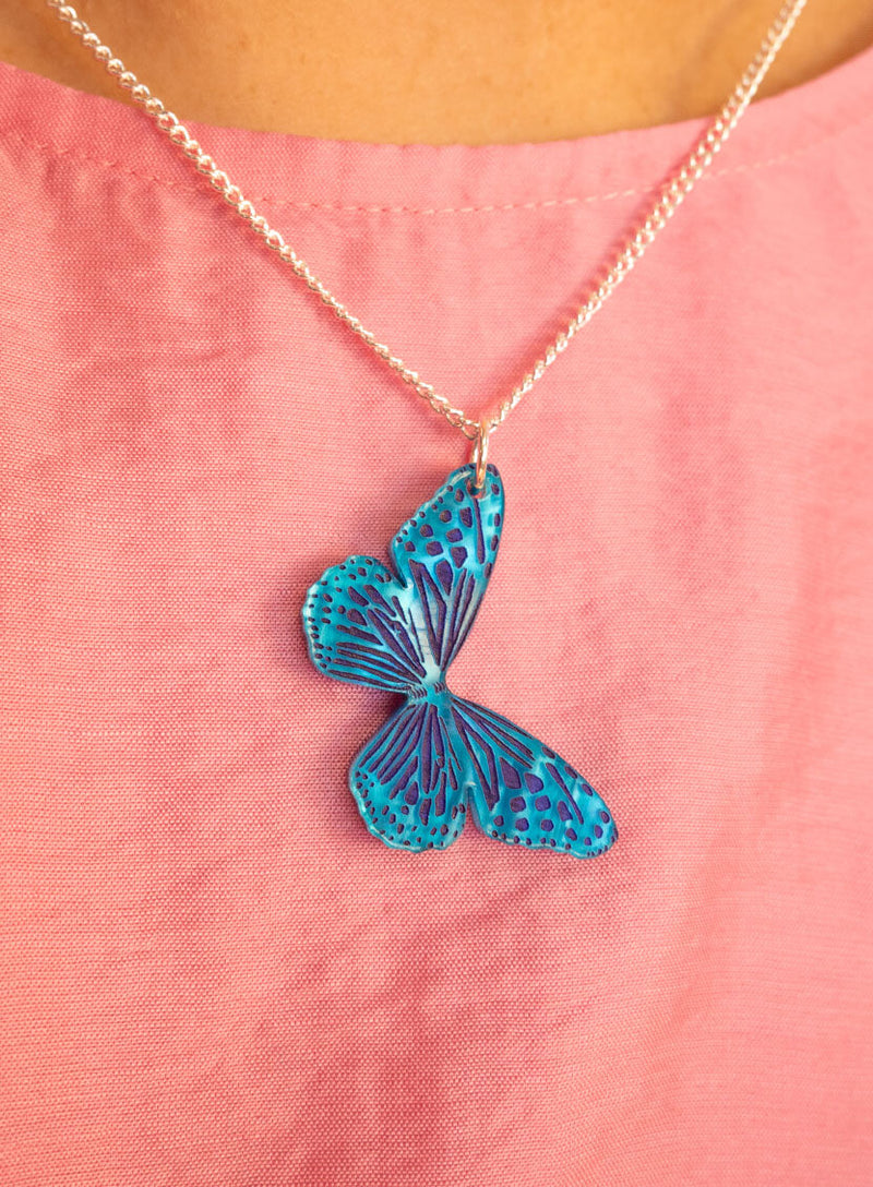 Blue butterfly pendant necklace