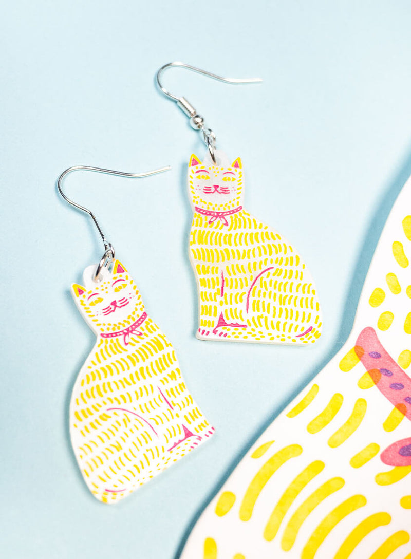 Cat Wearing A Ribbon Earrings The Printed Peanut