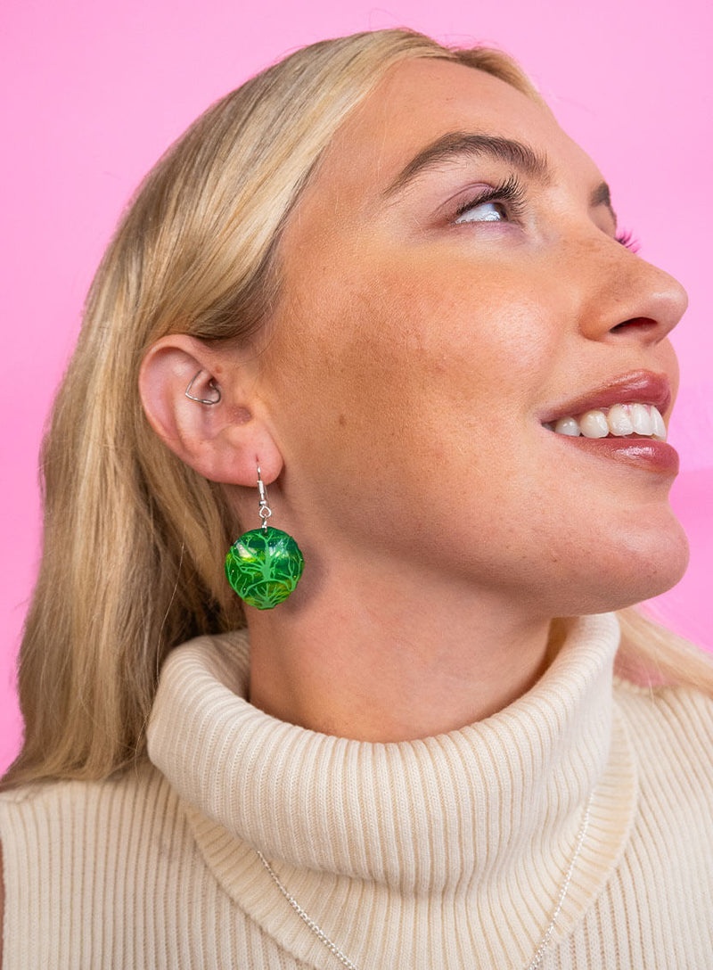 Brussels Sprout Earrings made from glitter-flecked green acrylic