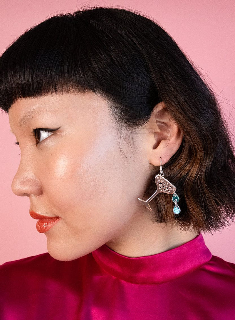 Tatty Devine Champagne Glass Earrings made from rose gold mirror acrylic