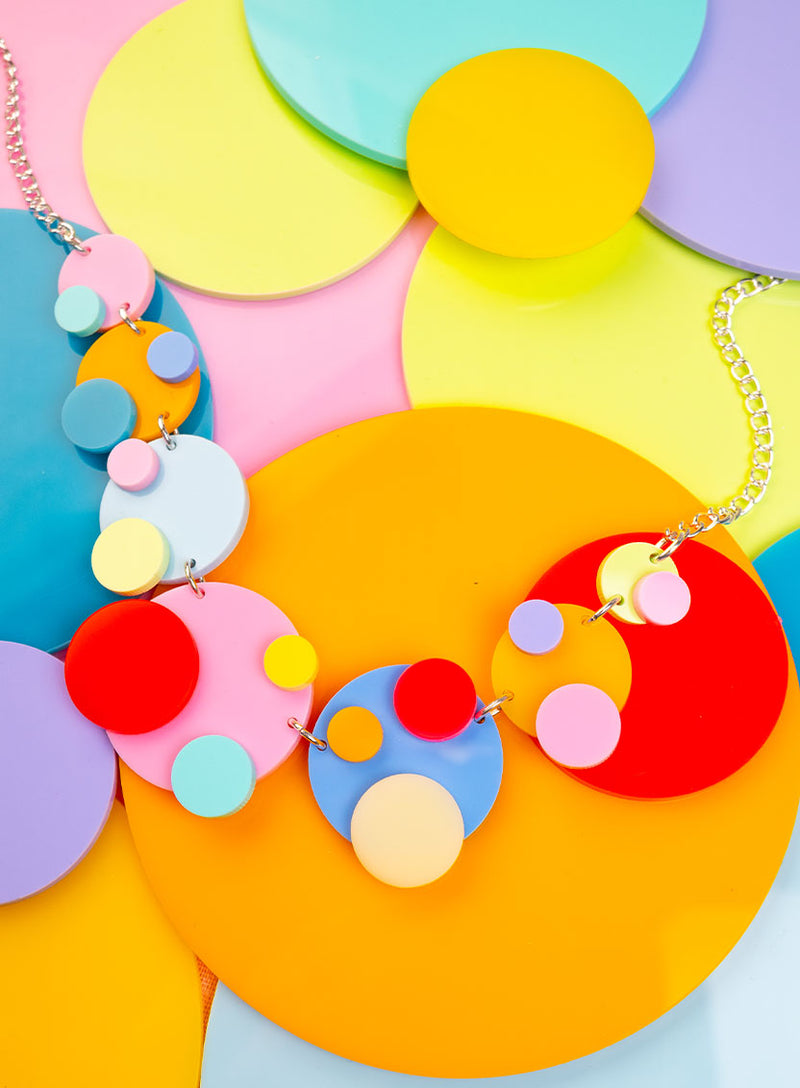 Colourful statement necklace made from multi colour acrylic circle polka dots