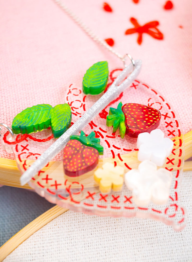 Embroidery Heart Necklace made from clear recycled acrylic etched and inked and adorned with strawberries