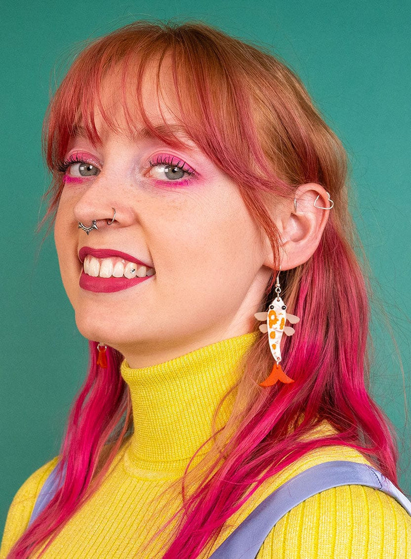Goldfish Earrings worn with a colourful outfit