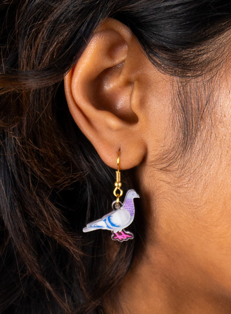 pigeon earrings gold closeup