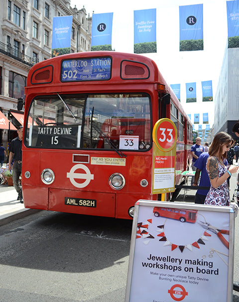 Tatty Devine celebrates at the Year of the Bus Cavalcade