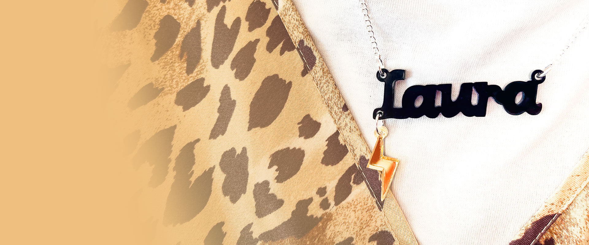 Black acrylic Name Necklace that says Laura with gold mirror bolt charm - click to create your own