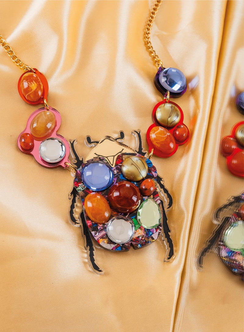 Metamorphosis Beetle Necklace Flatlay