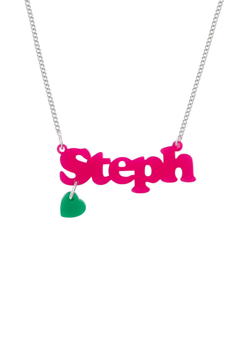 Personalised Name Necklace with 'Steph' pendant in bright pink acrylic, with a green heart charm, on a white background.