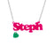 Personalised Name Necklace with 'Steph' pendant in bright pink acrylic, with a green heart charm, on a white background.