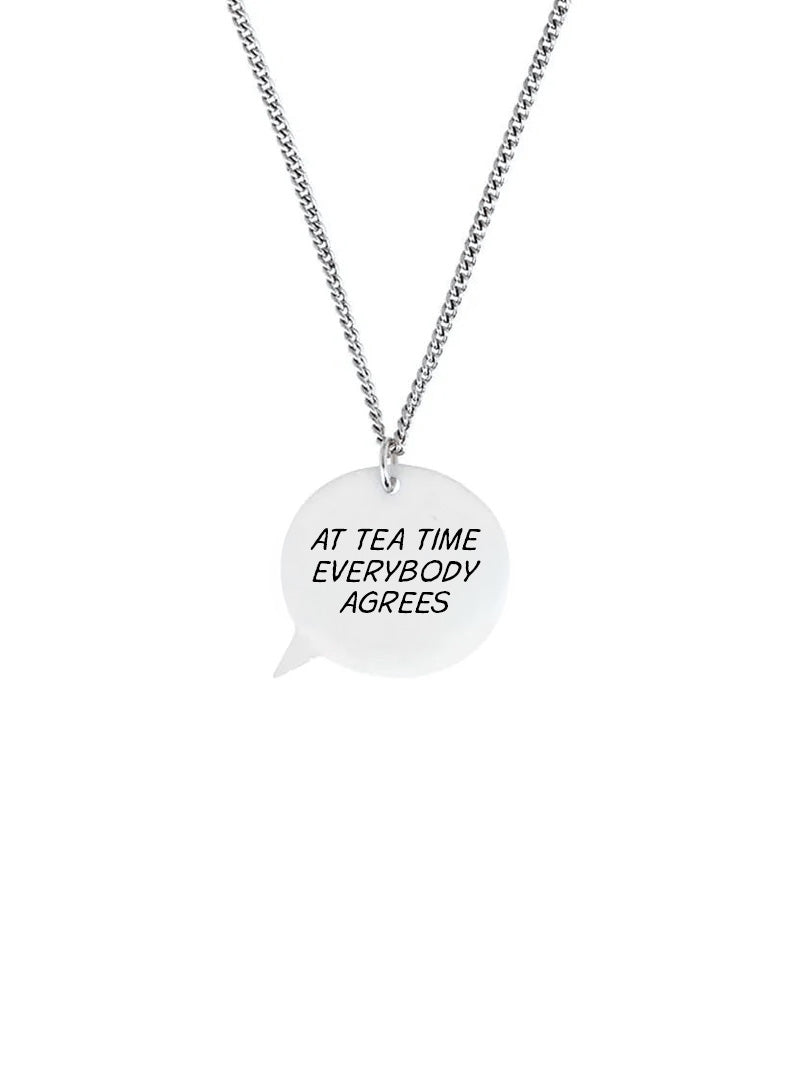 Personalised speech bubble necklace with a pendant that says 'At tea time everybody agrees' on a white background.
