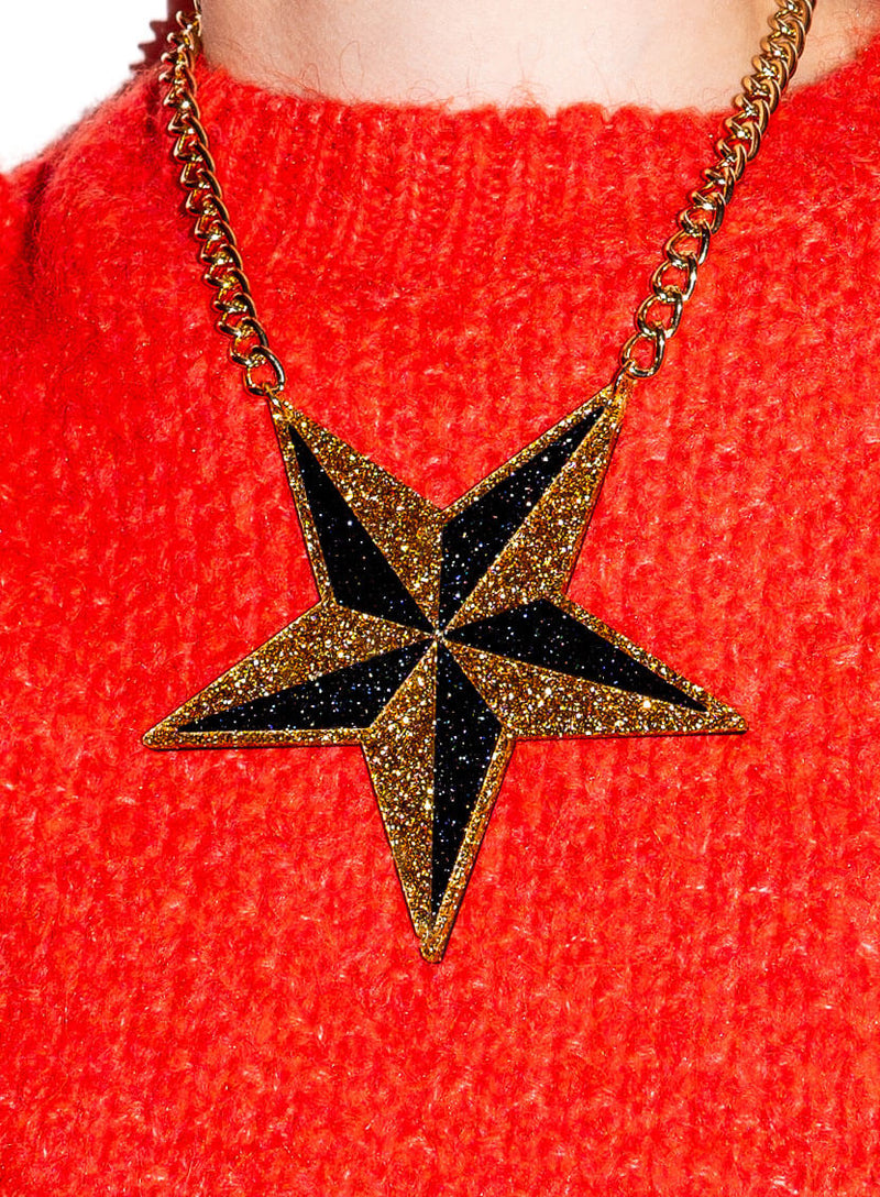 Large black and gold glitter star necklace made from acrylic