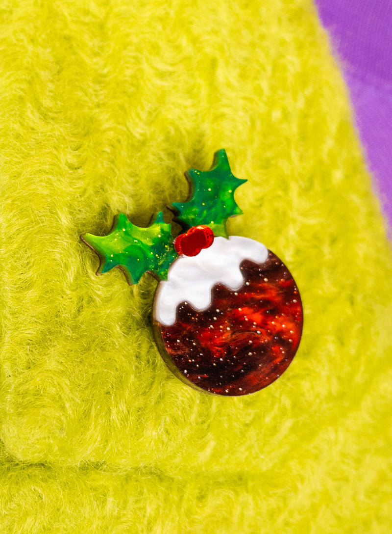 Christmas Pudding Brooch made from glitter flecked acrylic pinned to a yellow coat