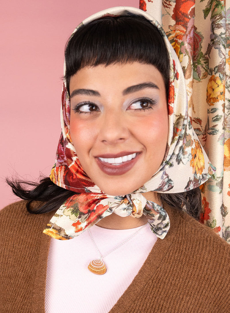 Cinnamon Roll Pendant worn by a model