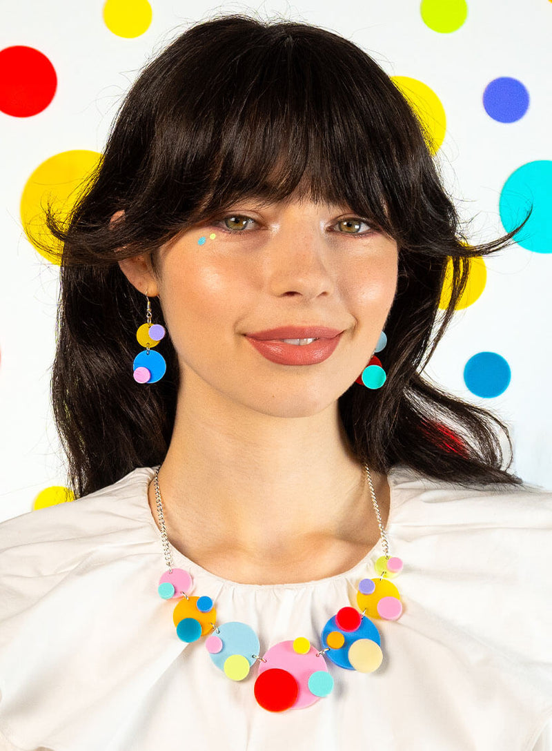 Colourful dots statement necklace and earrings worn together
