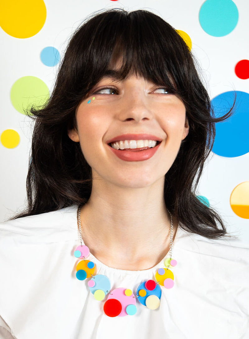 Colourful statement necklace made from multi colour acrylic circle polka dots
