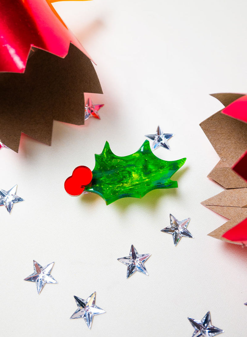 Christmas Holly Brooch falling out of a Christmas Cracker