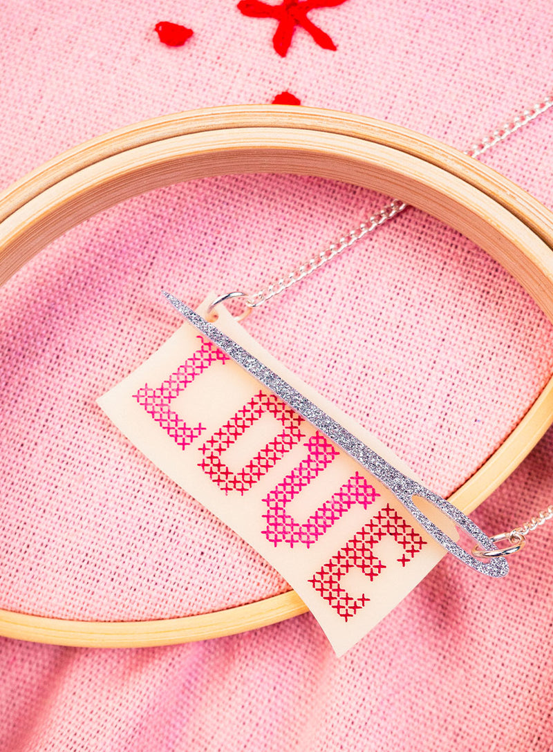 Love Cross Stitch Necklace made with acrylic and silver glitter needle