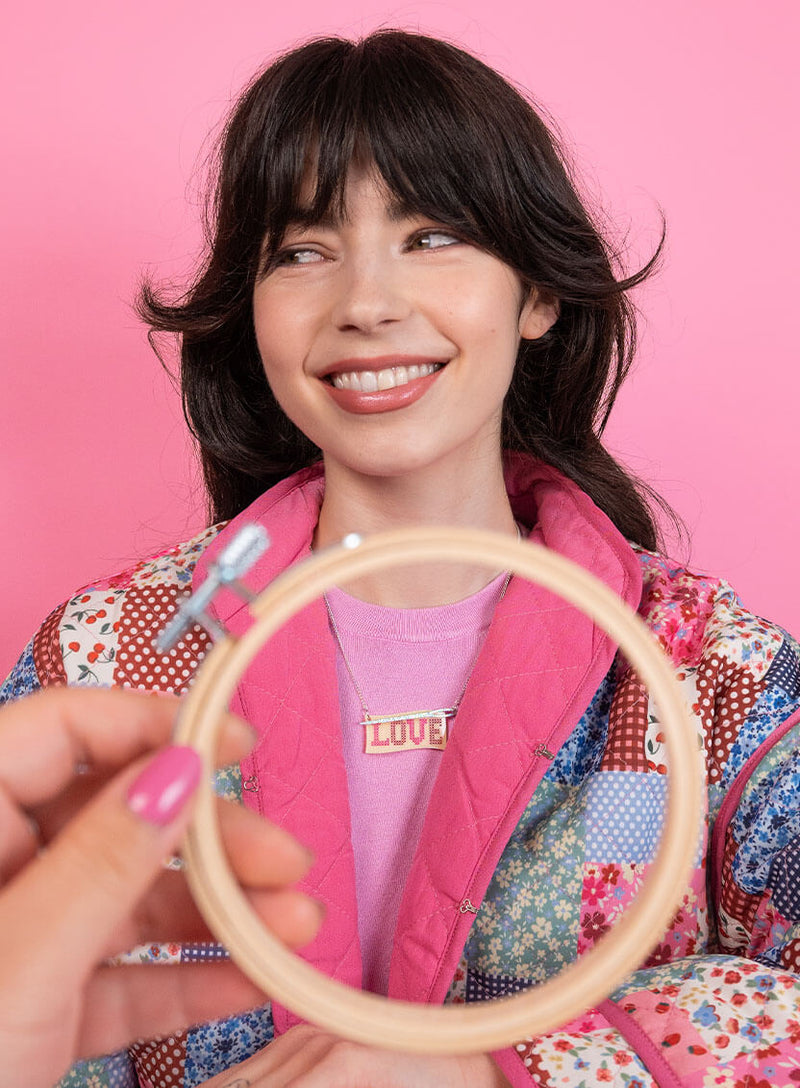 Love Cross Stitch Necklace made with acrylic and silver glitter needle