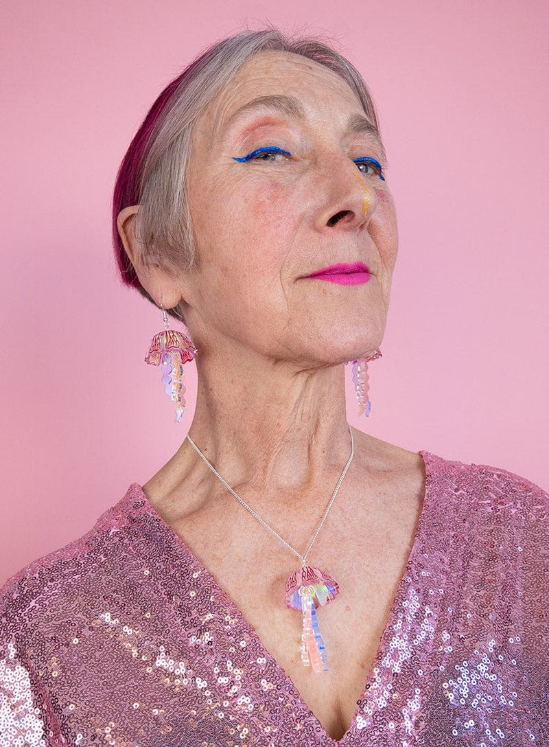 Iridescent Moon Jellyfish Pendant and Earrings worn with pink sequin top