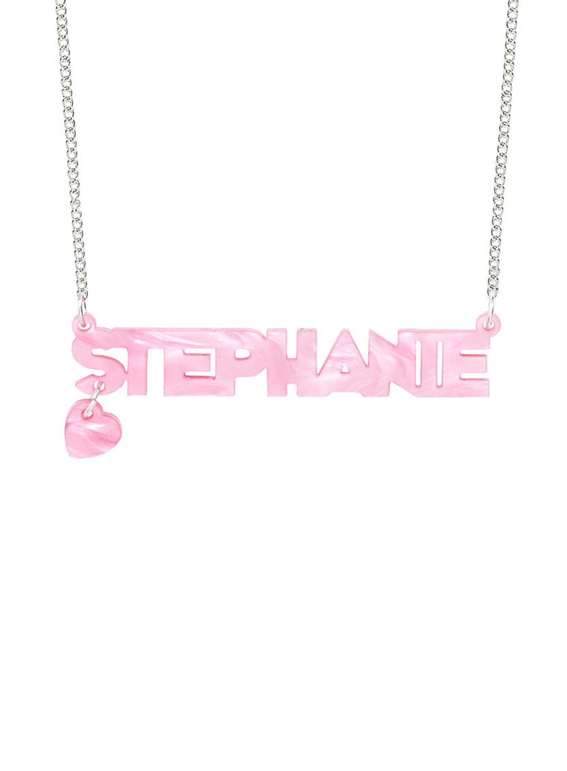 Tatty Devine Name Necklace with a heart shaped charm in recycled pink pearl. The name says: Stephanie.