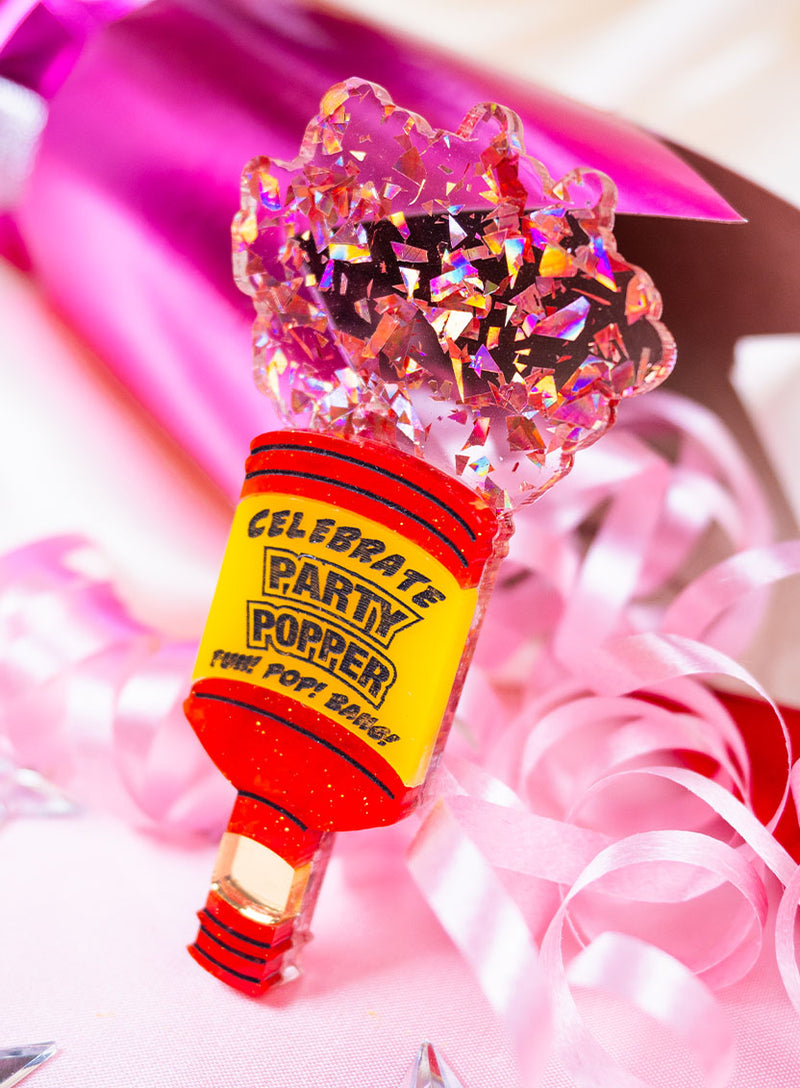 Party Popper Brooch placed on a table setting