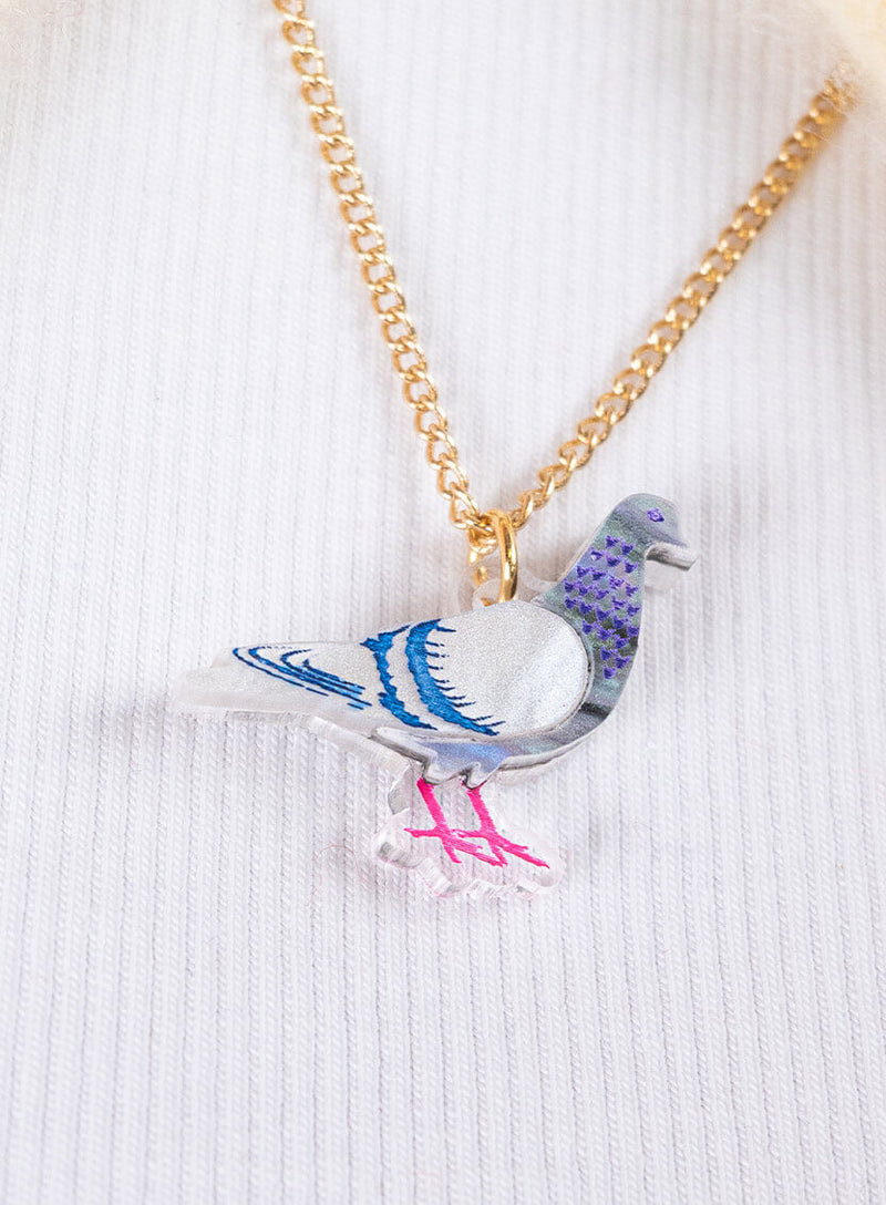 pigeon pendant gold closeup
