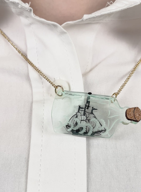 See-through curved recycled acrylic Ship In A Bottle Necklace with cork lid