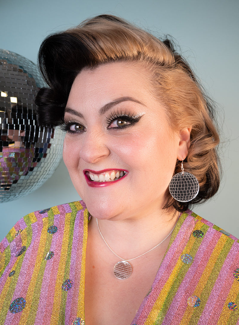 Kiri Pritchard-Maclean in the Deluxe Disco Ball Earrings and Disco Ball necklace.